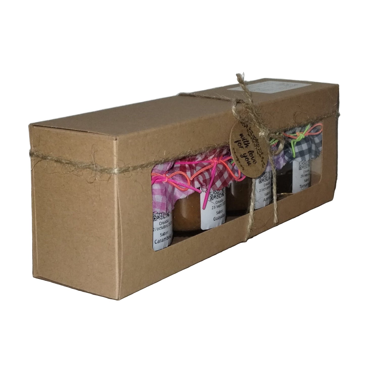 Caja de surtido de mermeladas sencillas de Del Palo Al Pote con sabores de carambola, guayaba, acerola y tamarindo, presentada en caja de cartón con lazo artesanal.